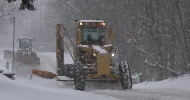 Plows clear a snow covered road — Stock Video