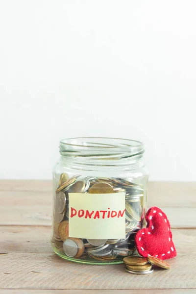 Coins Glass Jar Donation Label Red Heart Money Savings Charity — Stock Photo, Image