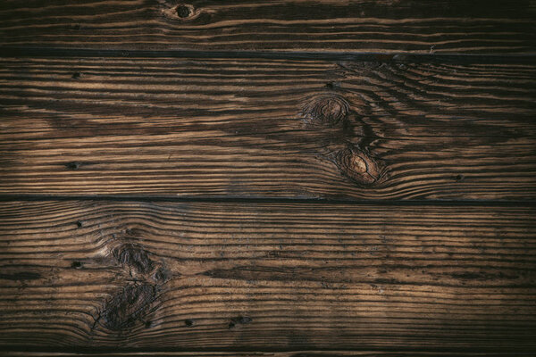 Rustic wooden board background close up - dark rustic empty backdrop, copy space for text, design element