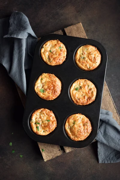 Protein breakfast egg muffins with cheese and vegetables. High protein muffins for ketogenic or paleo diet, top view.
