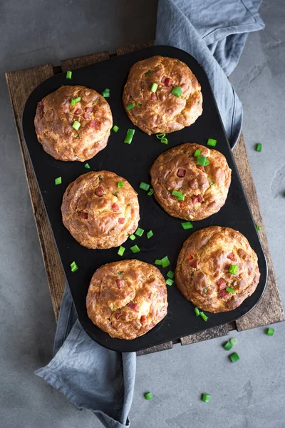Protein breakfast egg muffins with bacon and vegetables. High protein muffins for ketogenic or paleo diet, close up.