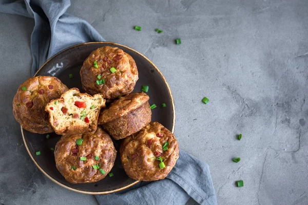 Protein breakfast egg muffins with bacon and vegetables. High protein muffins for ketogenic or paleo diet, close up.