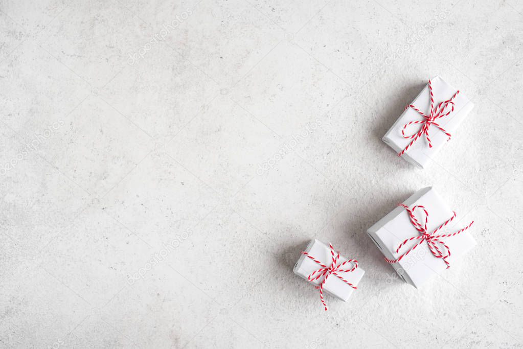 Christmas Gift Boxes in white background, copy space. White Christmas Gifts, winter festive composition, concept.