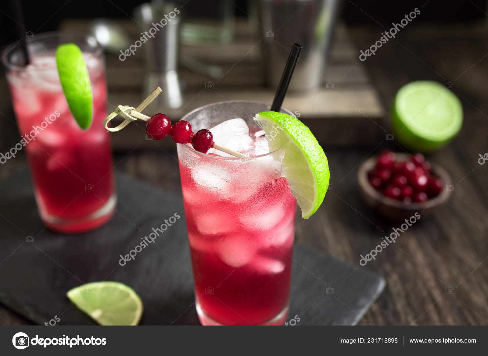 Cranberry Vodka Cocktail Lime Ice Black Table Cape Codder Cocktail - Main Image