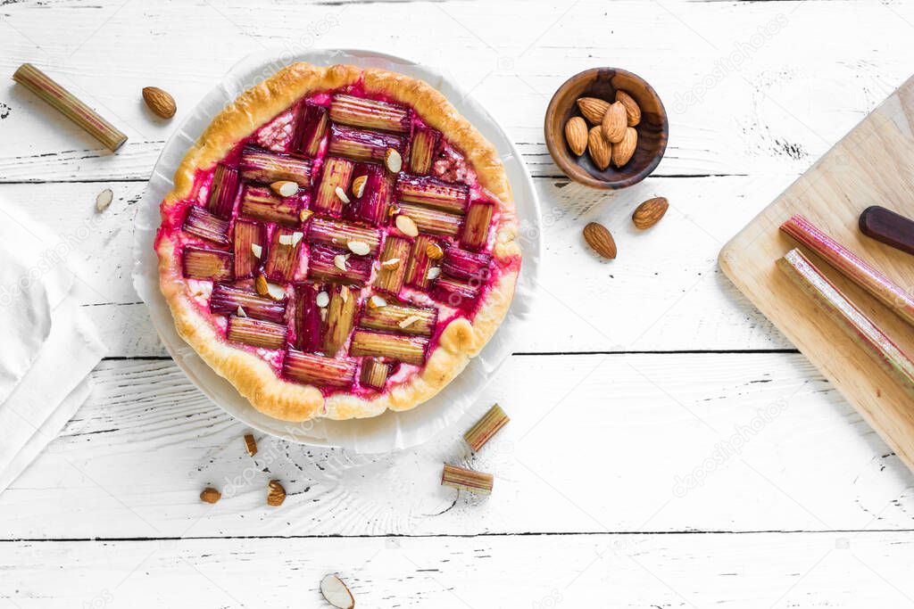 Rhubarb Pie or Tart with almonds, to view, copy space. Healthy homemade summer dessert, vegan rhubarb pie.