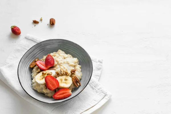 Oatmeal Coconut Porridge Strawberries Pecans Banana White Table Healthy Breakfast — Stock Photo, Image