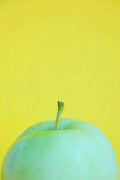 Template with copy space by front view closeup macro photo of fresh green apple.