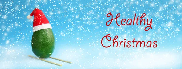 Christmas Decoration Snowfall Background Idea Frsh Green Avocado Skiing Santa — Stock Photo, Image