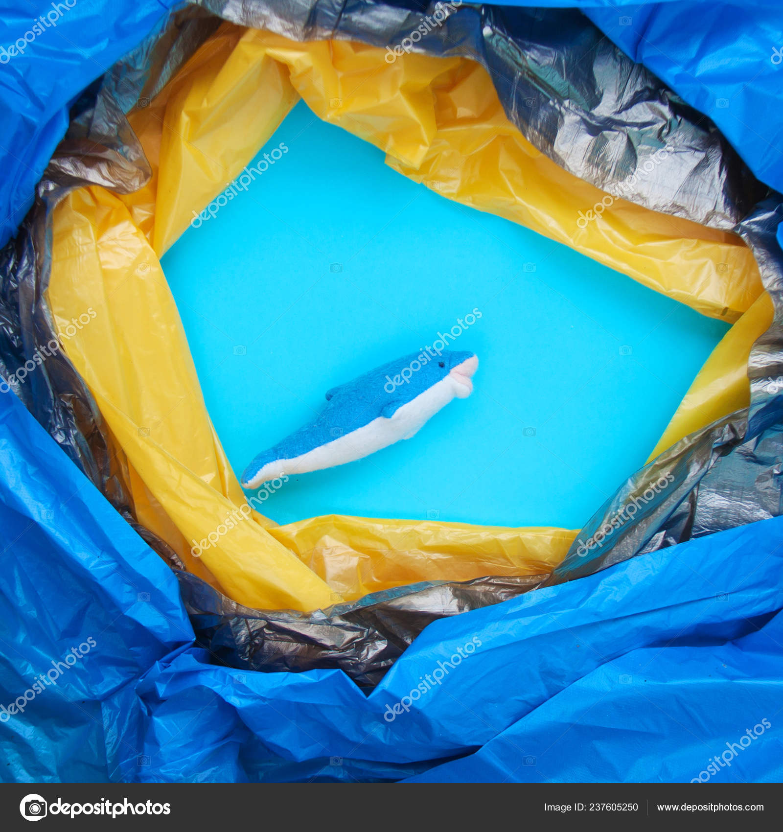 Blue Dolphin Swims Yellow Black Plastic Waste Trash Floating Ocean