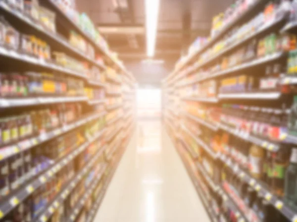 Abstrato borrado moderno varejo supermercado corredor prateleiras com da — Fotografia de Stock