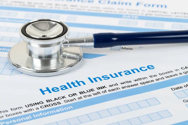 Health insurance application form with stethoscope and calculato — Stock Photo, Image