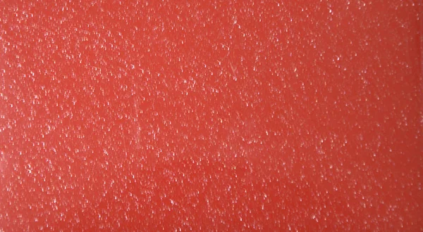 Red glossy plain background. Metallic. Texture Close-up