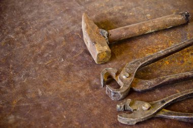 Wrenches top view for construction, industrial, electrician concept design. Old rusty wrench over battered metal table rough style. Labour day background concept. A concept for FathMetal bunch wrenches rusty iron metal tools lying on dark steel table