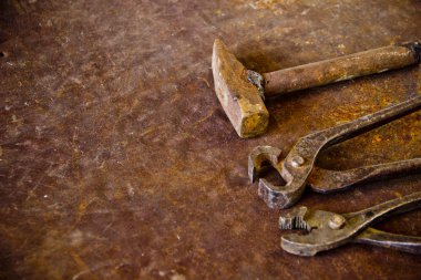 Wrenches top view for construction, industrial, electrician concept design. Old rusty wrench over battered metal table rough style. Labour day background concept. A concept for FathMetal bunch wrenches rusty iron metal tools lying on dark steel table