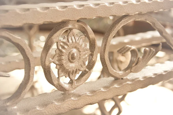 The fragment of forged metal products. close-up. Ornamental forging, forged elements. Elements for designer work. Samples of forged products. Decoration element of stairs handrails or balcony. Decorative parts of metal, elements of hand forging