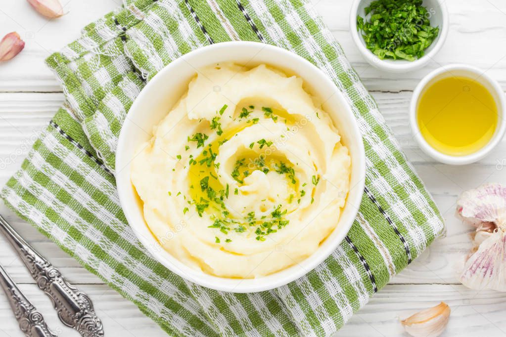 Mashed potatoes with parsley and olive oil in bowl, tatsy lunch