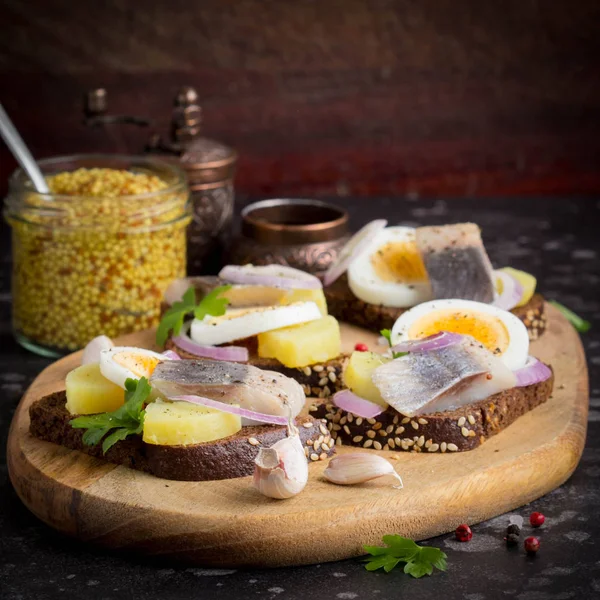 Sandwich Bread Herring Potatoes Egg Onion Tasty Appetizer Mustard Board — Stock Photo, Image