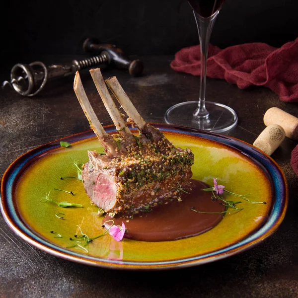 Rack Lamb Breaded Pistachio Nuts Dark Sauce Herbs Pink Meat — Stock Photo, Image