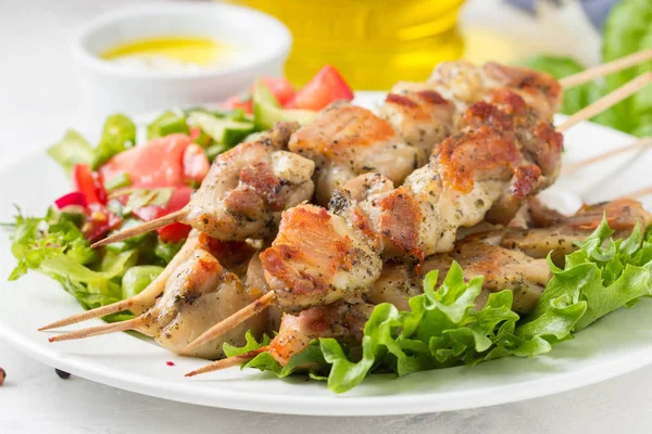 Meat kebabs (chicken, Turkey, pork) on wooden skewers with veget — Stock Photo, Image