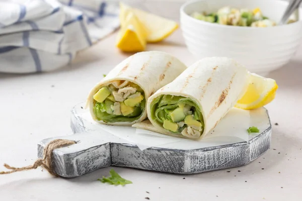 Grill roll of flatbread stuffed with avocado, cucumber, egg and — Stock Photo, Image