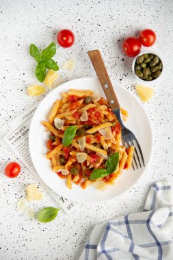 Traditional pasta putanesca with tomato sauce (capers, onions, g clipart