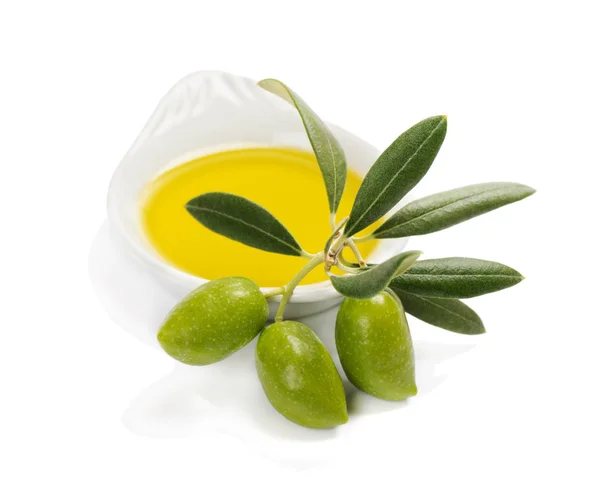 Olivenfrüchte und Olivenöl in einer Schüssel Stockbild