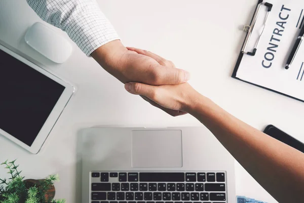 Top view of a strong handshake between man and woman