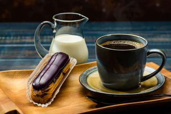 French coffee with cream and Eclair