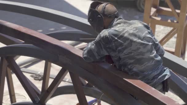 Male Welder Works Welding Metal Construction Taps Iron Hammer — Stock Video