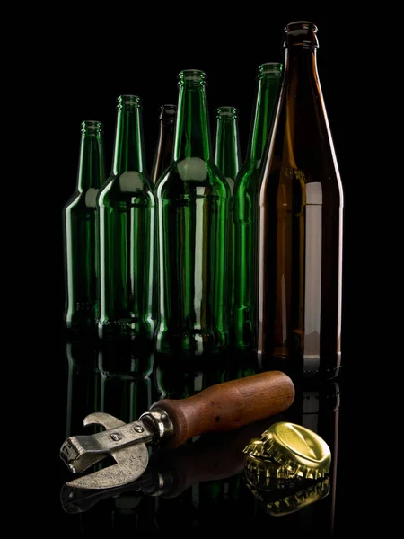 Old Can Opener Group Empty Beer Bottles Isolated Black — Stock Photo, Image