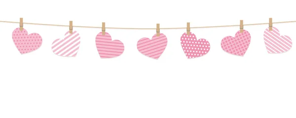 Pink hanging hearts on a rope on white background — Stock Vector