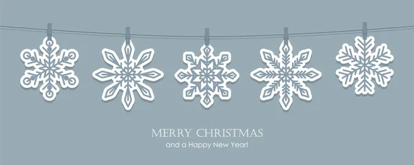 Graue Weihnachtskarte mit hängenden Schneeflocken — Stockvektor