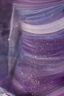  Donmuş boya karışımları, inanılmaz desenler ve lekeler oluşturuyor. Renkli soyut epoksi reçine resminin makro fotoğrafı. Güzel soyut desen. kaleydoskop geometrik biçimi.