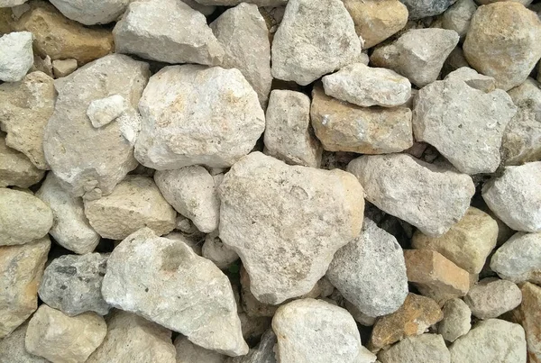white stones. it is a lot of stones. texture. background.