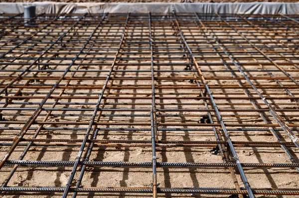 Reinforced Foundation for pouring concrete in the construction of a house on a plot of land. — Stock Photo, Image