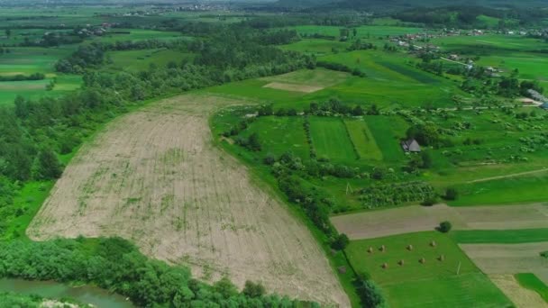 Aerial drone view of small community situated in beautiful landscape. 4K. — Stock Video