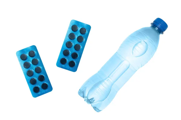 Бутылка Воды Таблетки Лекарствами Голубой Упаковке Close White Isolate — стоковое фото
