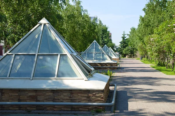 Buildings in the form of a pyramid. In the city.