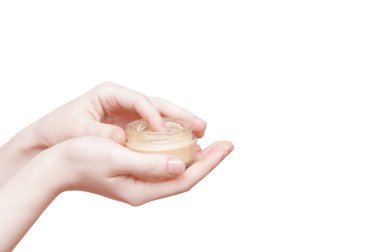 Bir kız el yüz kremi bir kavanoz ile kapatın. Beyaz izole