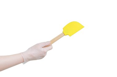 Kremler ve tatlılar karıştırma için silikon spatula. Kadın elinde. Beyaz izole