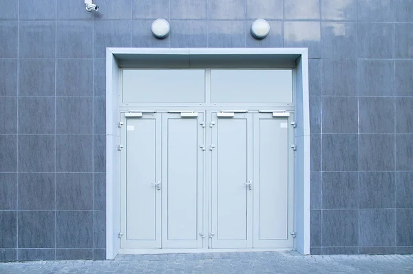 Two metal gray door. Service entrance to the building.