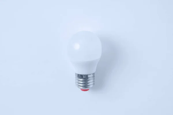 LED lamp on a white background. View from above. Electrical accessories.