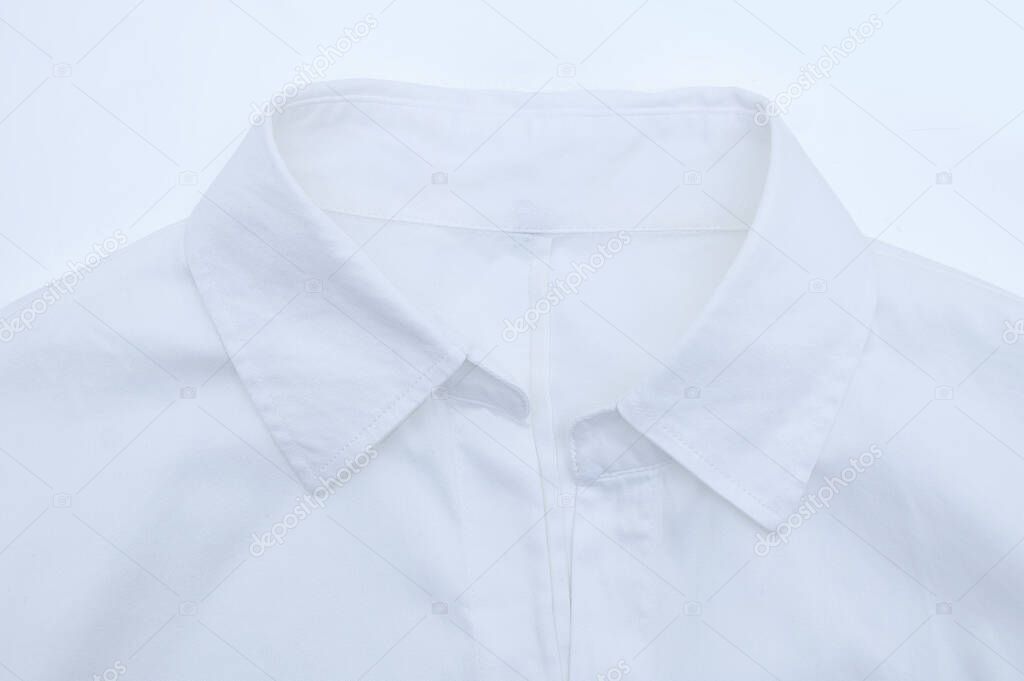 White women shirt with a collar close-up on a white background.