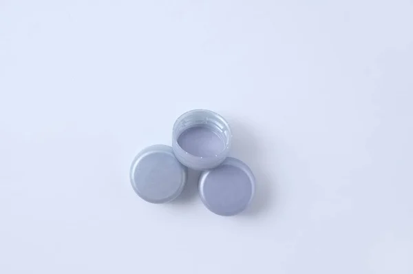 Three Gray Plastic Bottle Caps White Background — Stock Photo, Image