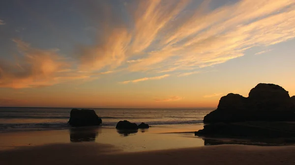 Sunset sky and moving clouds at beach