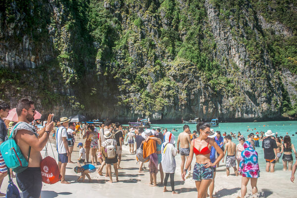 Krabi, Thailand - January 2018: Overcrowded Maya Bay beach, closed indefinitely after environmental damage from tourists