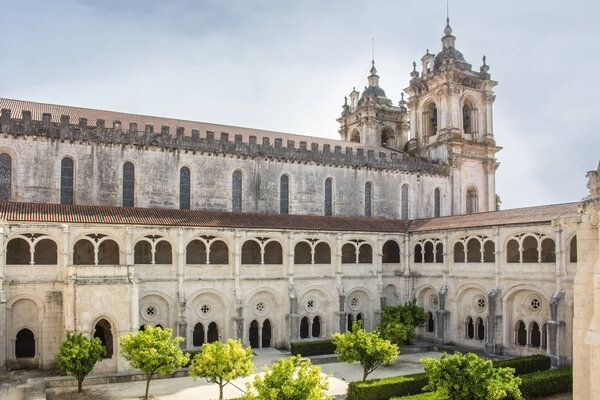 Alcobaca, Portugal - August 2018: View of the cloister garden from the upper storey of Alcobaca Monastery on sunny day.