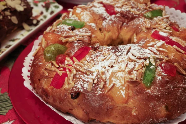 Close-up of a Bolo-rei in a decorative red platter. A traditional Portuguese cake usually eaten around Christmas. Royalty Free Stock Images