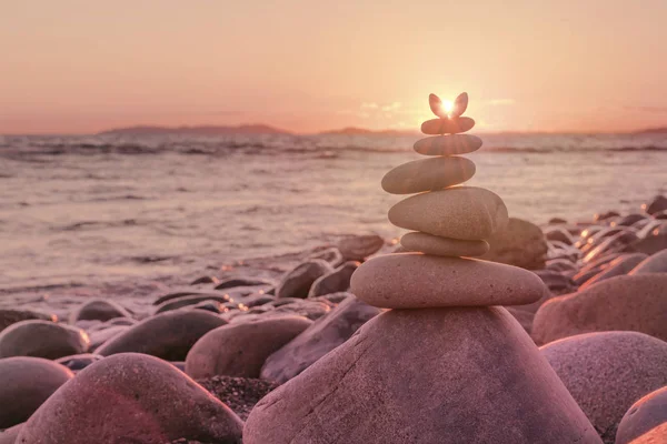 Balance Stones Shining Rays Sun Background Sea Pink Sunset Stock Photo