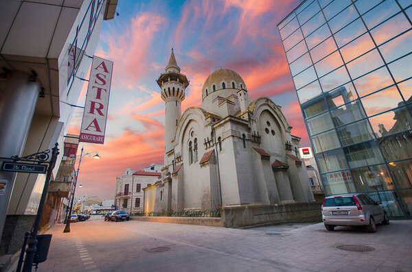 Constanta, Romania - 10 December, 2019: Great Mahmudiye Mosque (Carol I) at sunset. Located in the history center of the old town in the city.